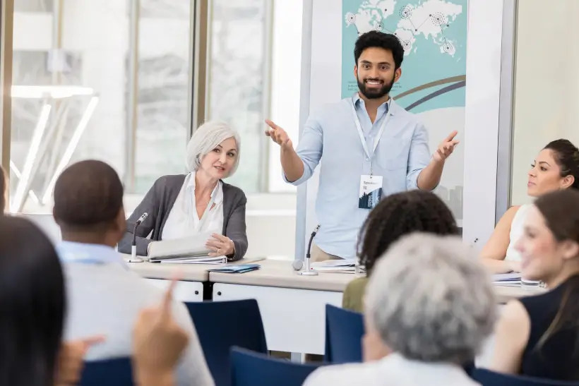 Man presenting at a business meeting.